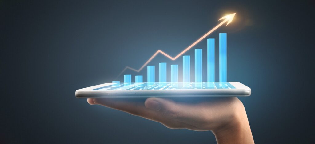 Hand holding tablet with rising bar chart and arrow, symbolizing product usage data driving business growth